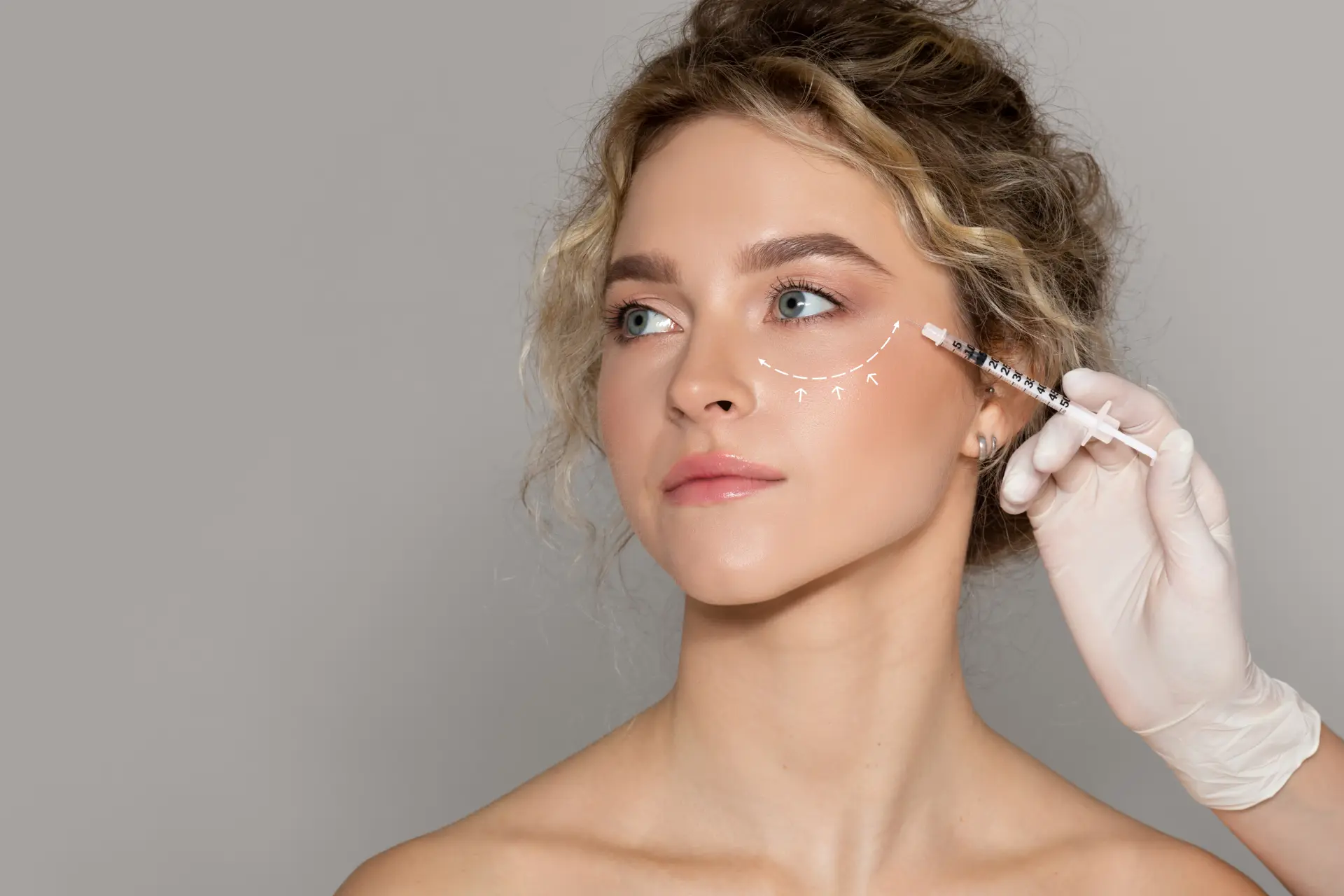 beautician-doctor-making-injection-woman-with-drawn-line-eye-lady-getting-mesotherapy