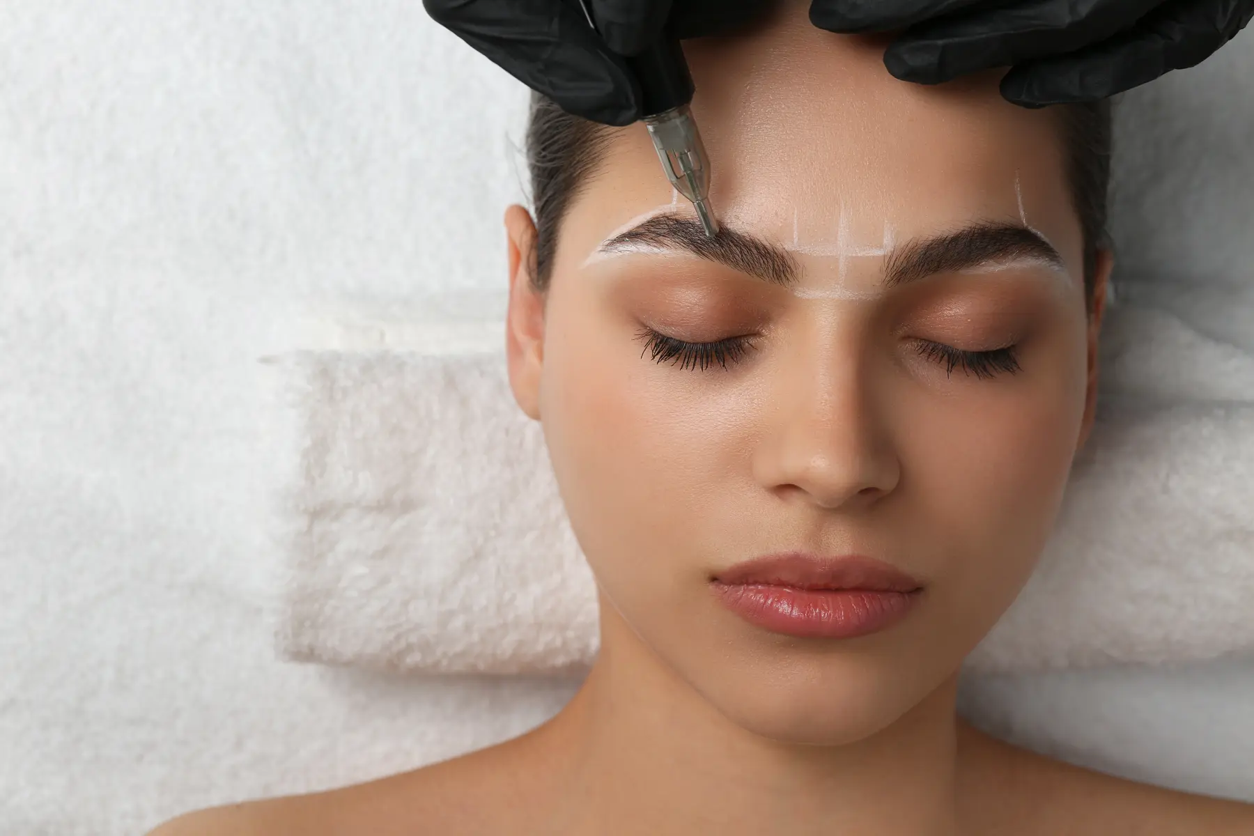 beautician-making-permanent-eyebrow-makeup-to-youn-2026-06-16-06-27-36-utc