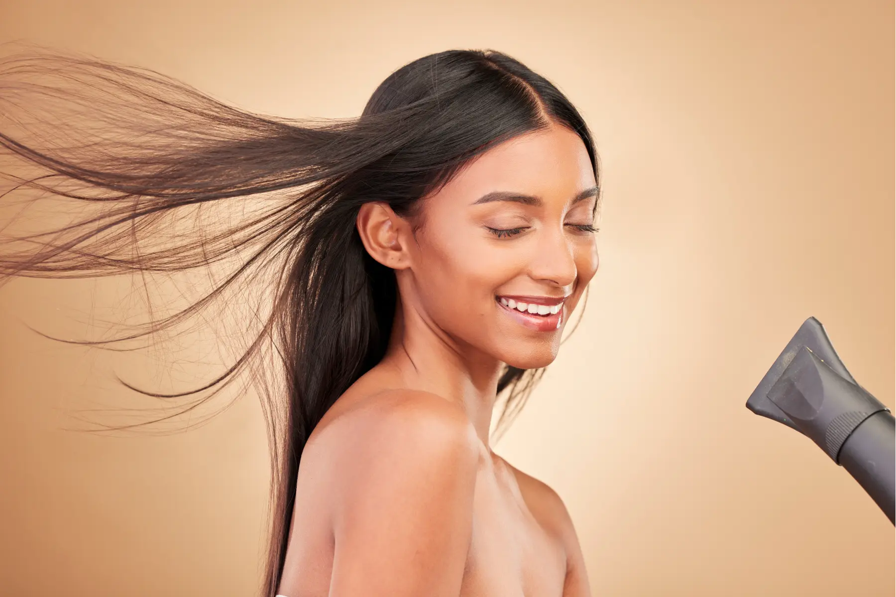 beauty-hairdryer-and-young-woman-in-a-studio-with-2026-01-09-09-29-56-utc