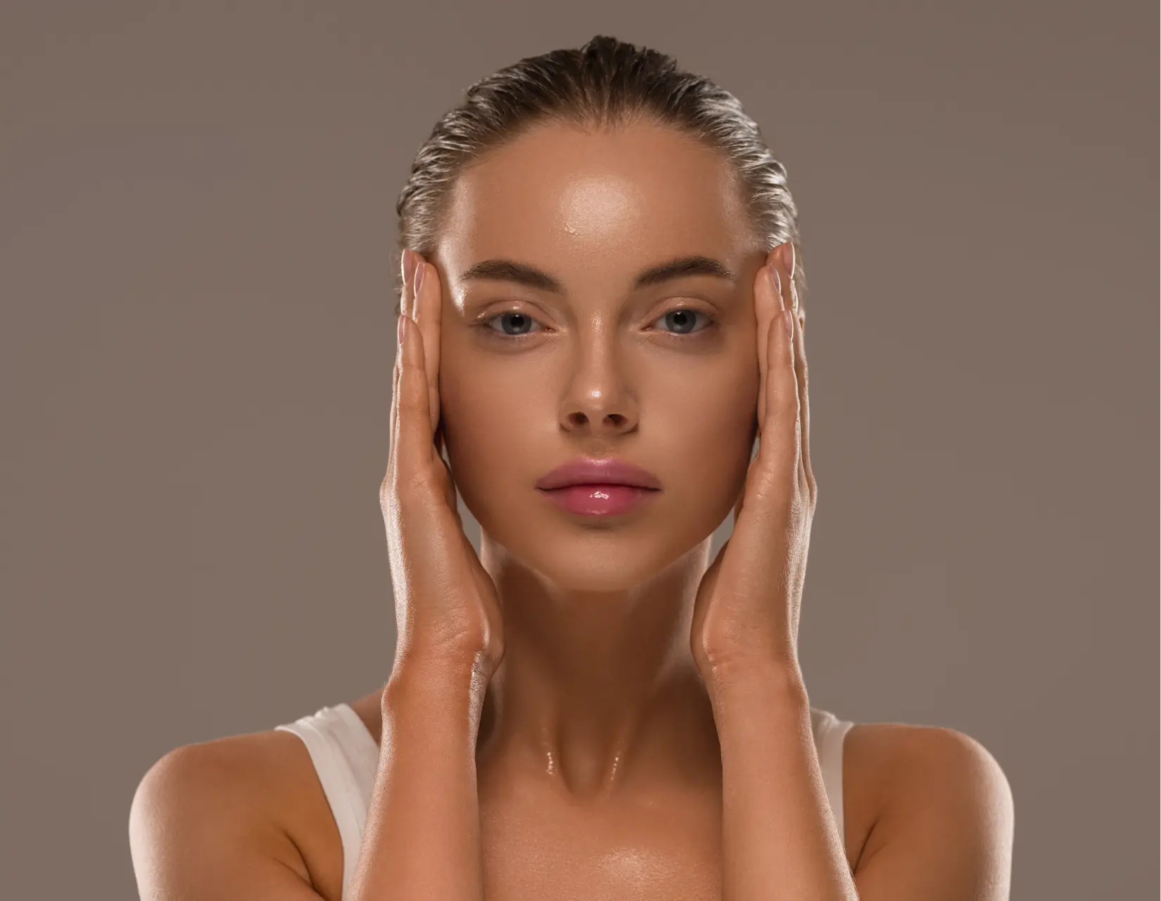 beauty-woman-with-hands-healthy-natural-make-up-clean-fresh-skin-concept-color-background (1)