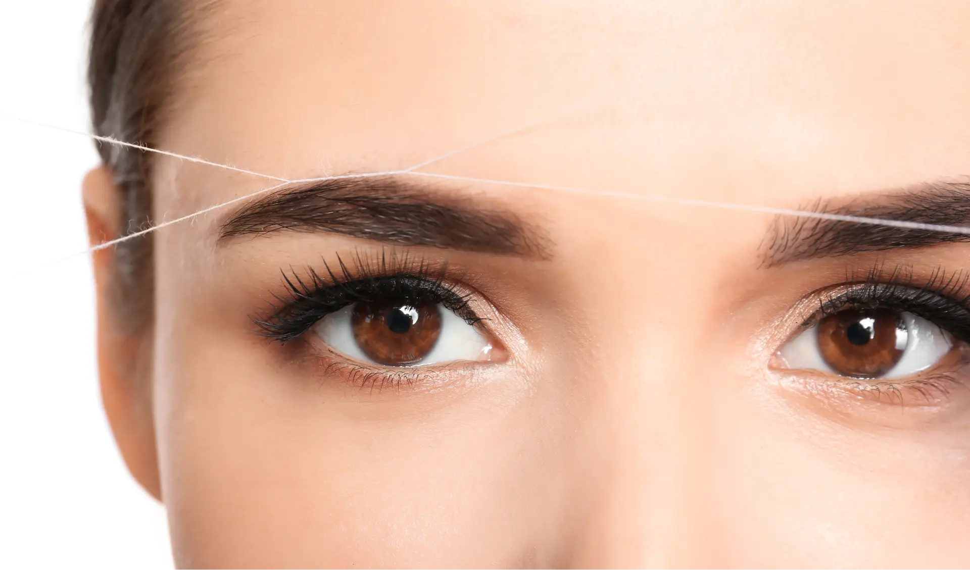 brow-threading-close-up-on-a-woman-s-face-2026-01-26-17-17-12-utc