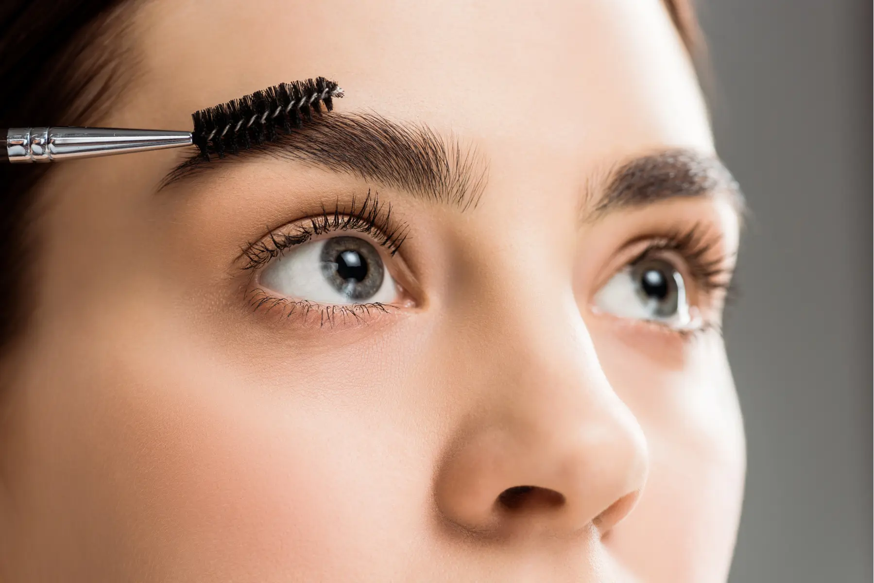 cropped-view-of-young-woman-styling-eyebrow-with-e-2026-03-13-01-19-46-utc