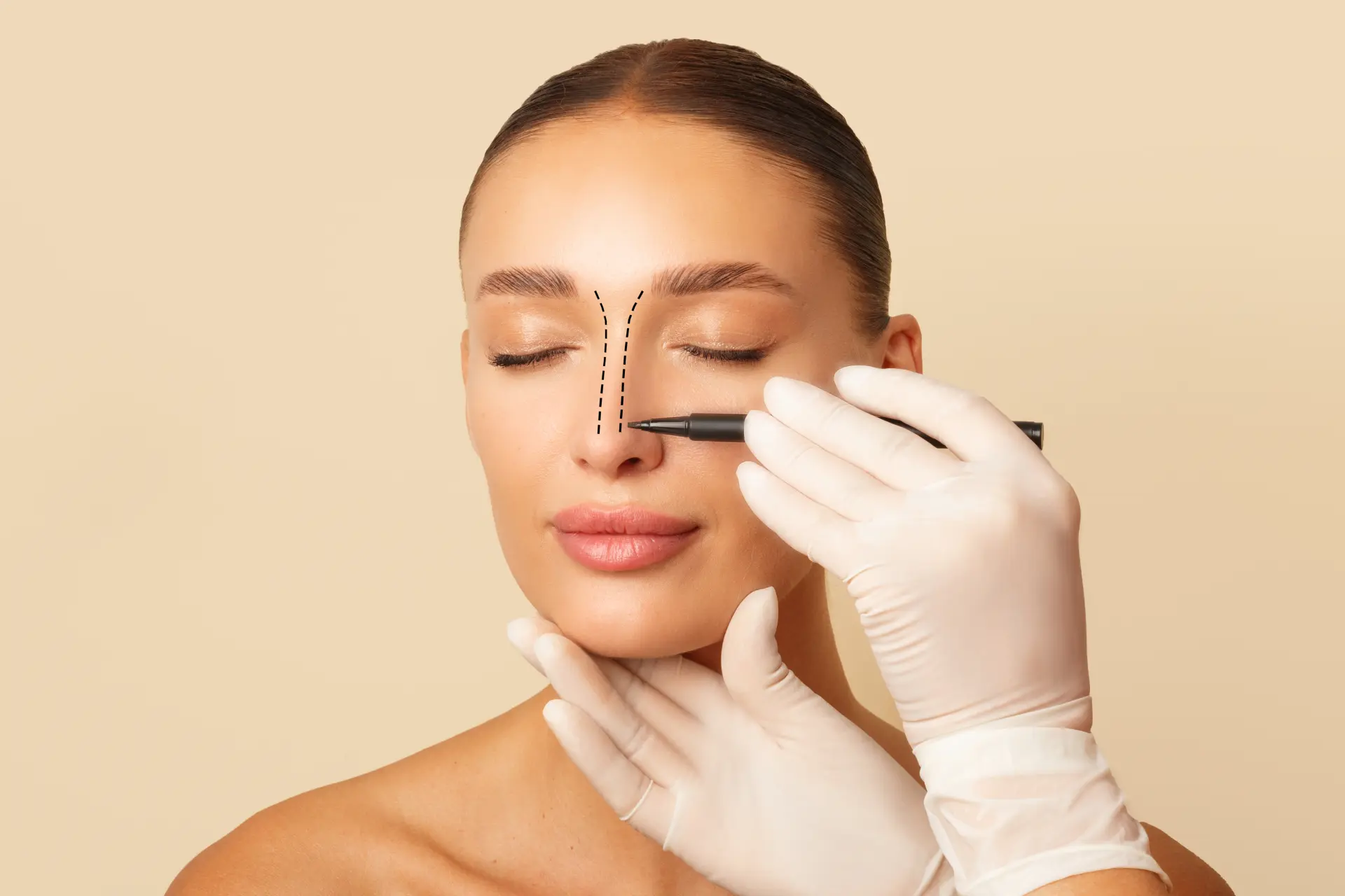 doctor-making-marks-female-nose-young-woman-posing-beige-studio-background-with-closed-eyes