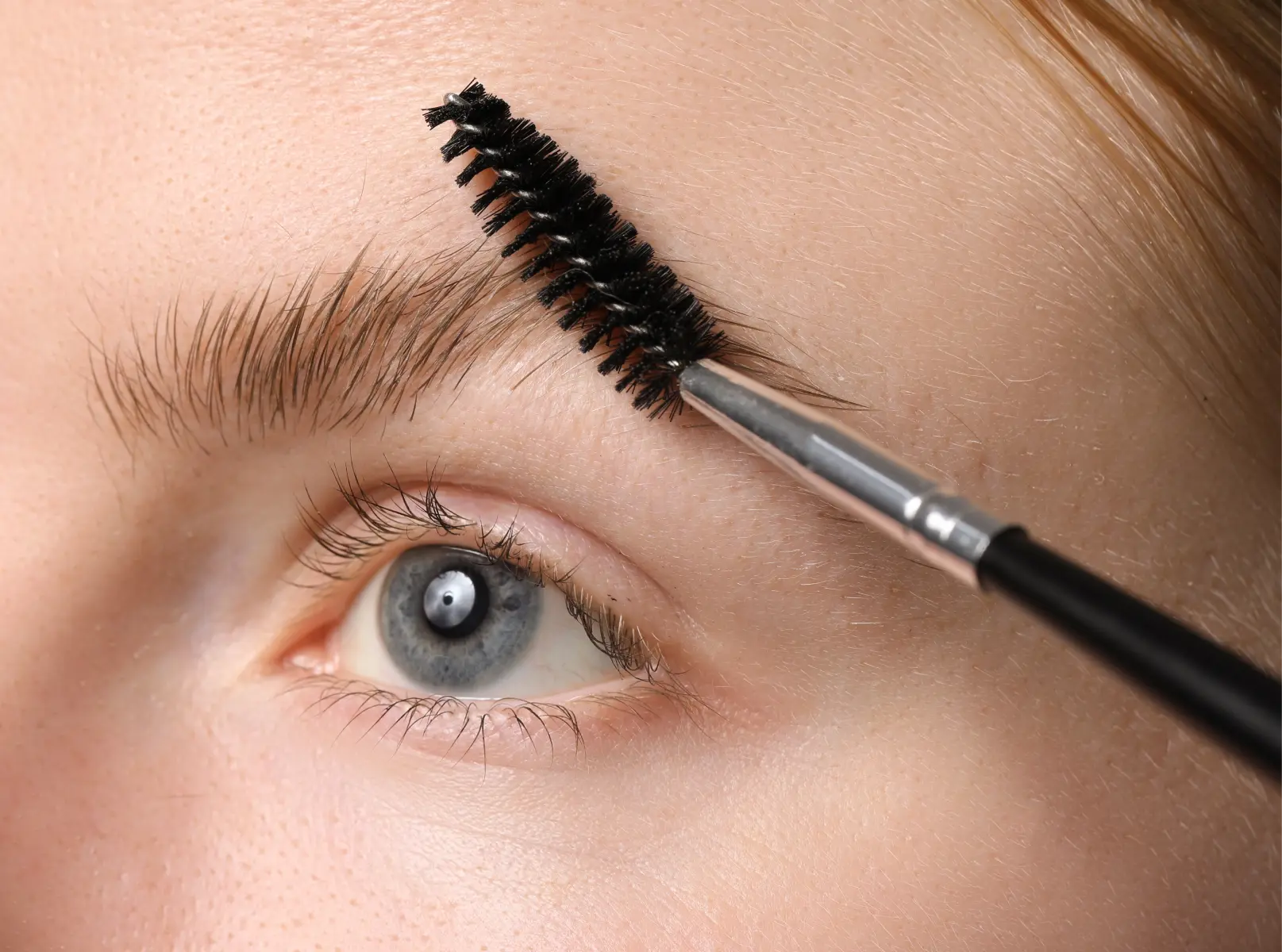 extreme-close-up-of-a-woman-grooming-her-eyebrow-w-2026-06-16-06-29-35-utc