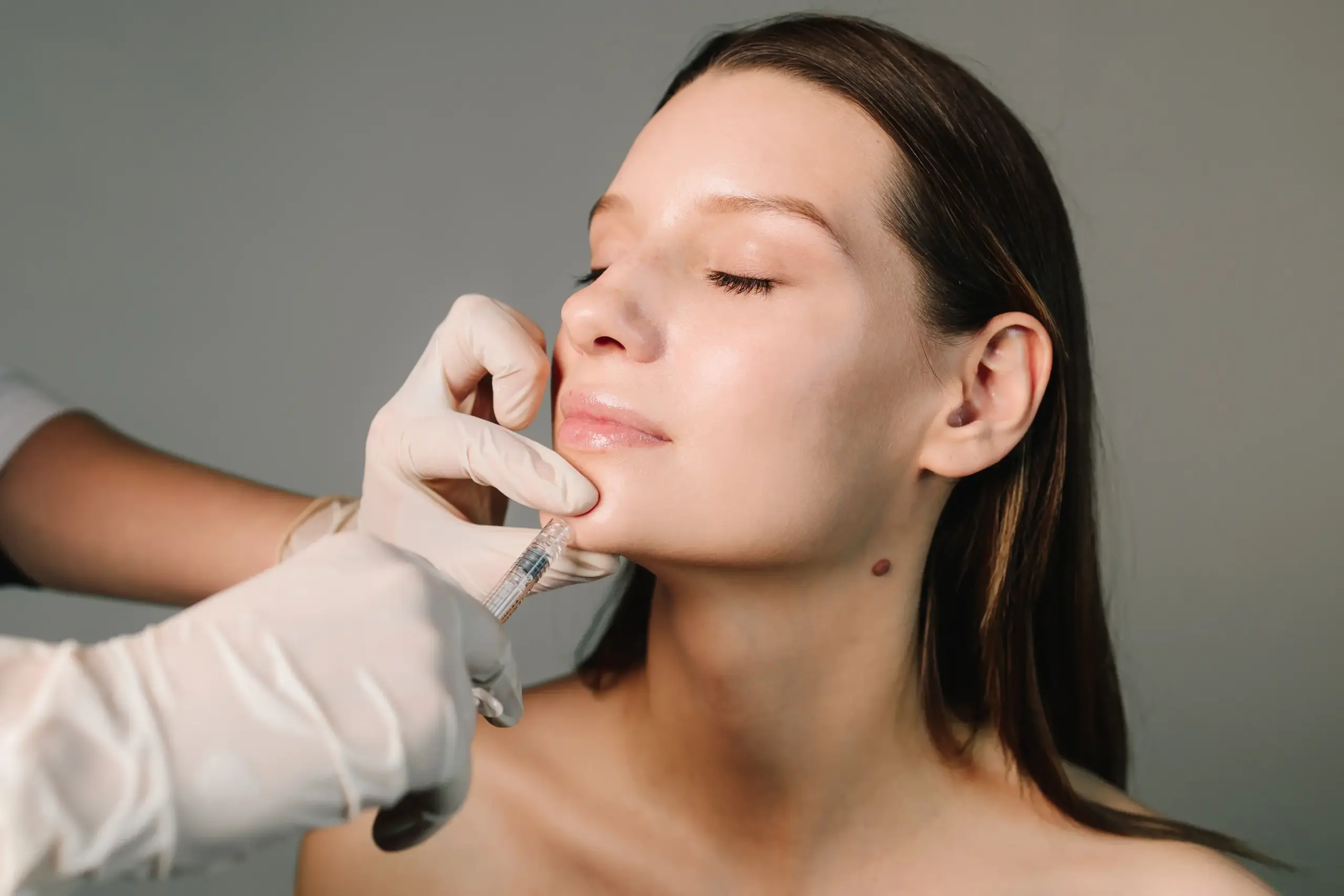 facial-filler-injections-aesthetic-medical-clinic-attractive-girl-contouring-shape-jawline-chin-high-quality-filler-injections