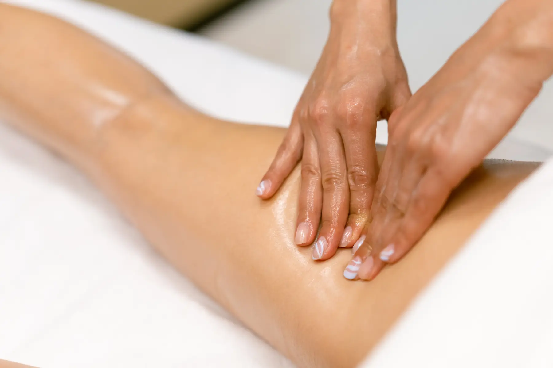 hands-massaging-leg-in-spa-setting-2026-01-11-11-08-08-utc