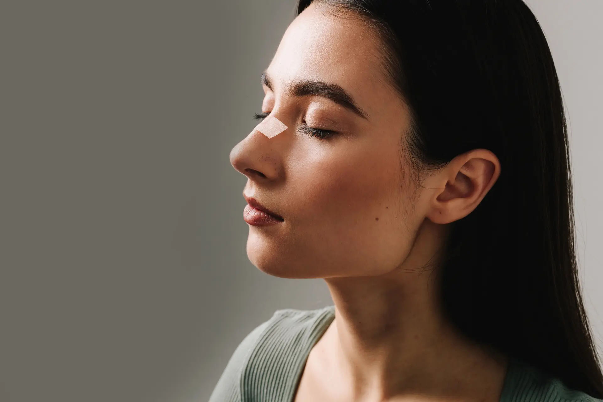 rhinoplasty-applying-bandage-nose-after-surgery-support-its-shape-decrease-swelling-improve-appearance-plastic-surgeon-is-taping-nose-patient-rhinoplasty-recovery