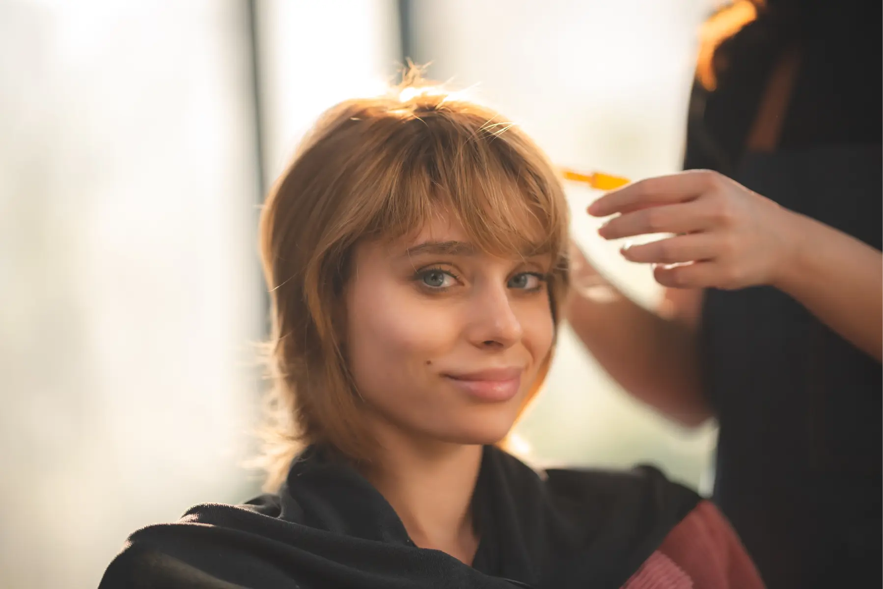smiling-woman-in-salon-getting-hair-styled-2026-03-24-23-17-28-utc