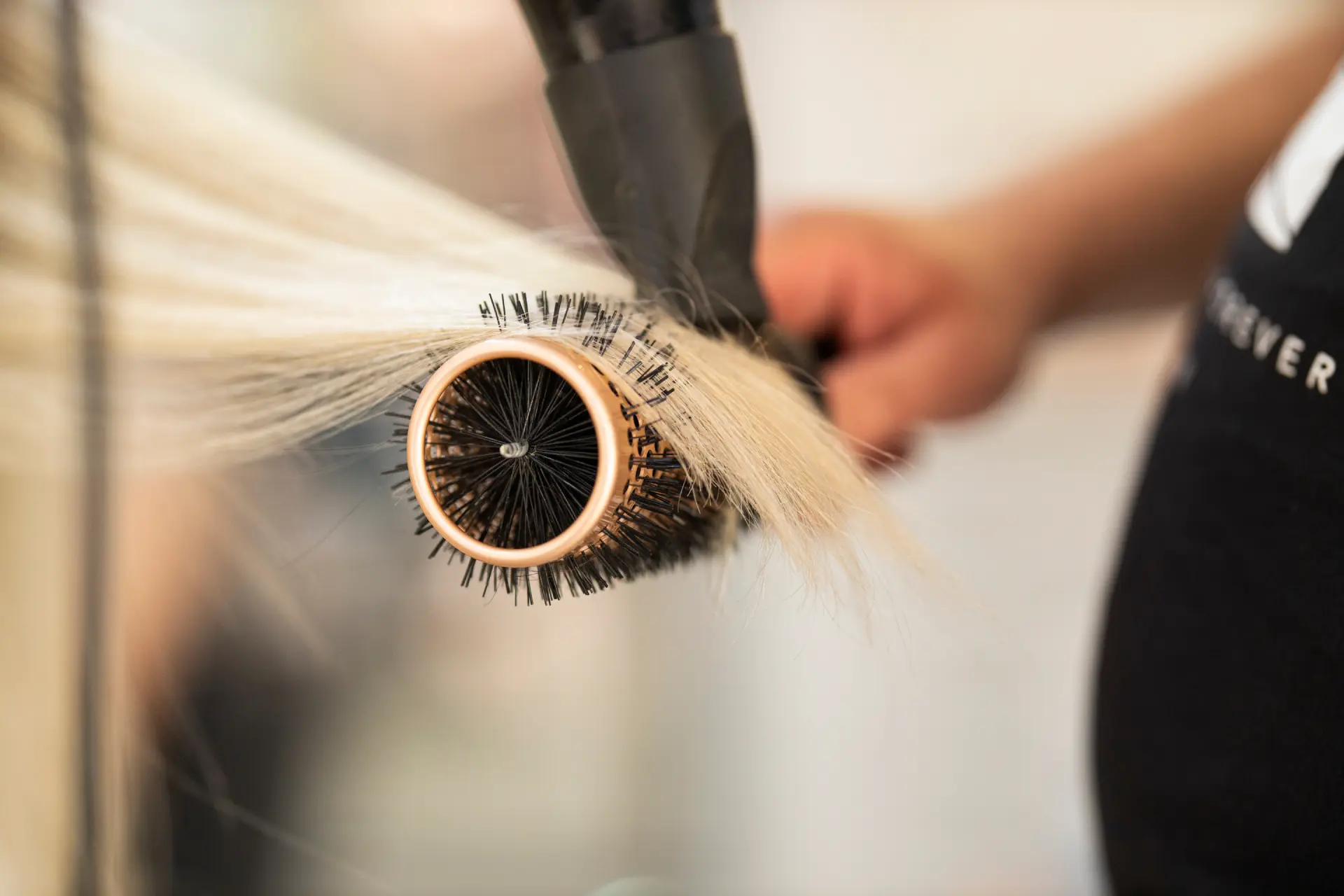 styling-blonde-hair-with-round-brush-and-dryer-2026-03-26-04-00-21-utc