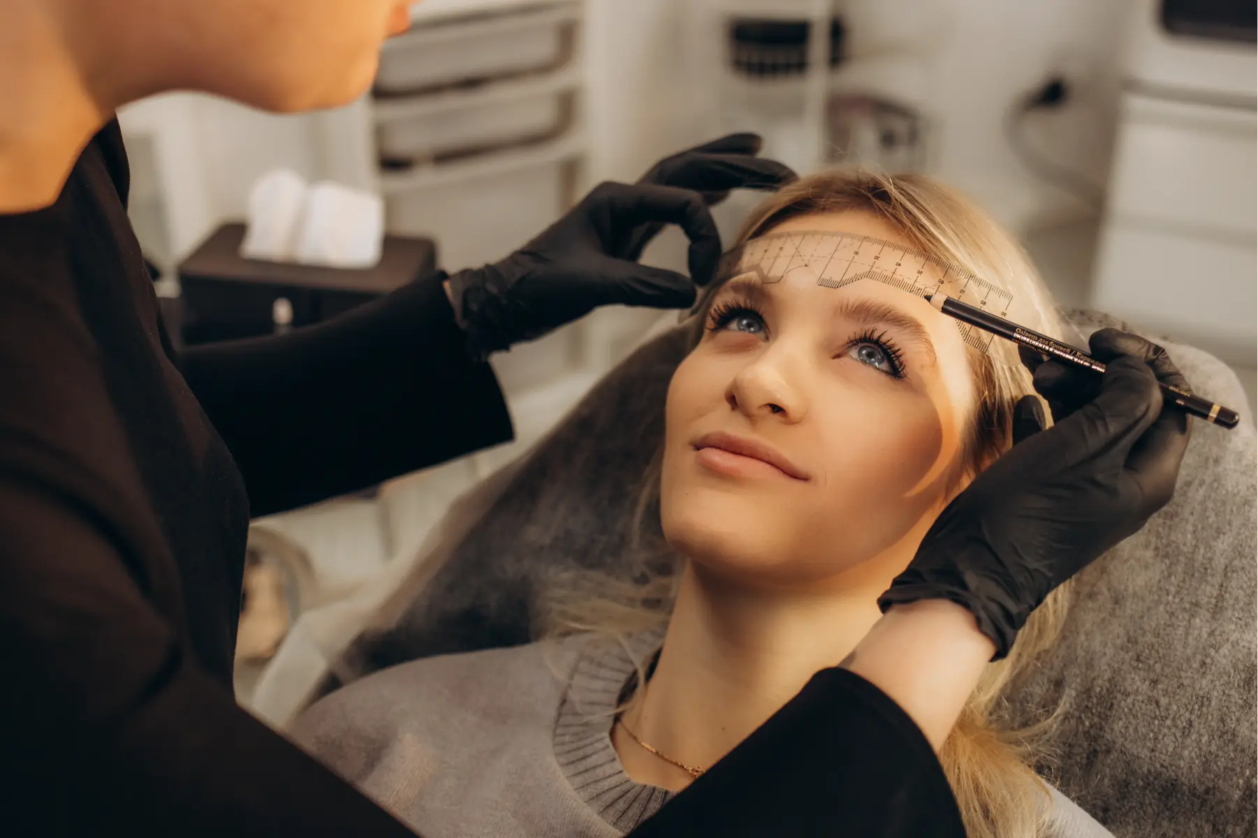 woman-getting-eyebrow-treatment-at-beauty-salon-2026-03-24-00-32-17-utc