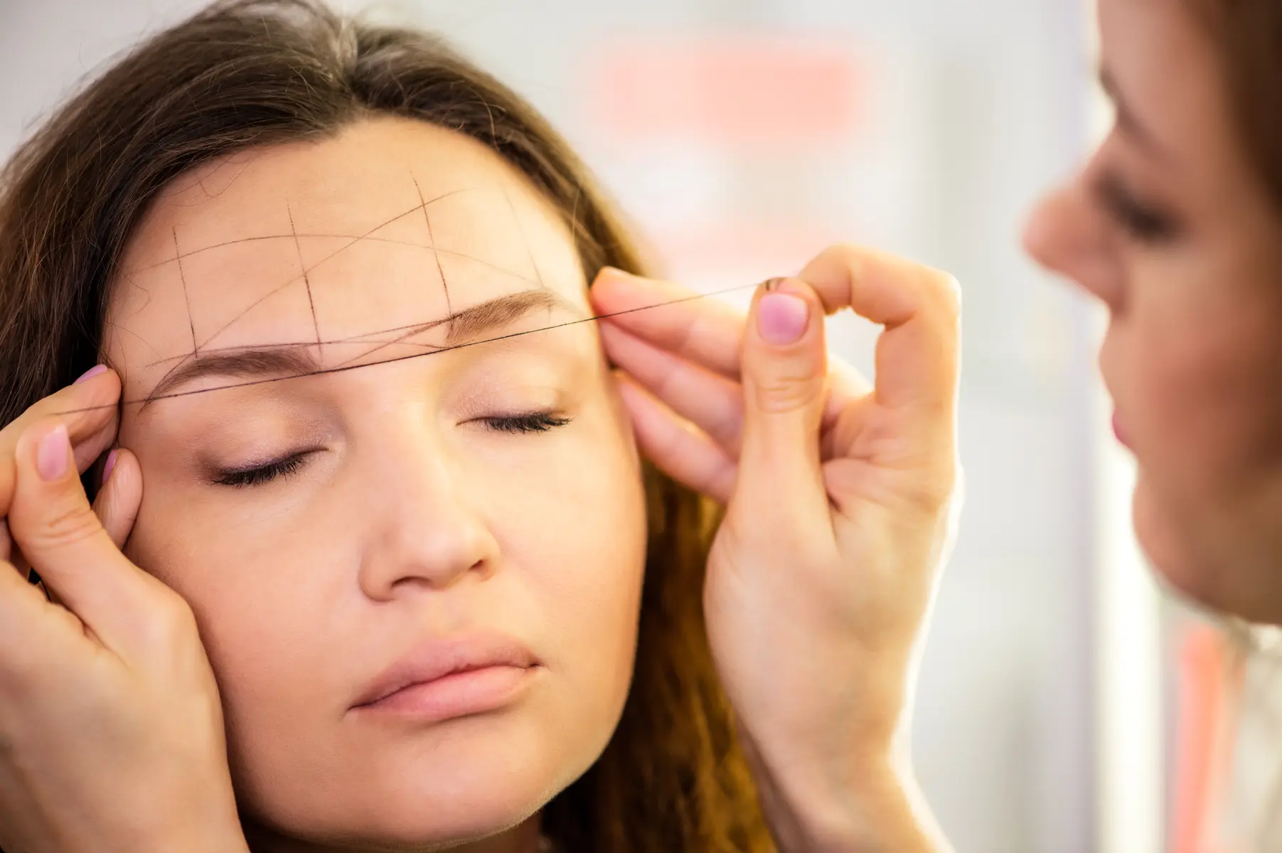 woman-getting-eyebrow-treatment-with-threading-pro-2026-03-16-01-21-08-utc