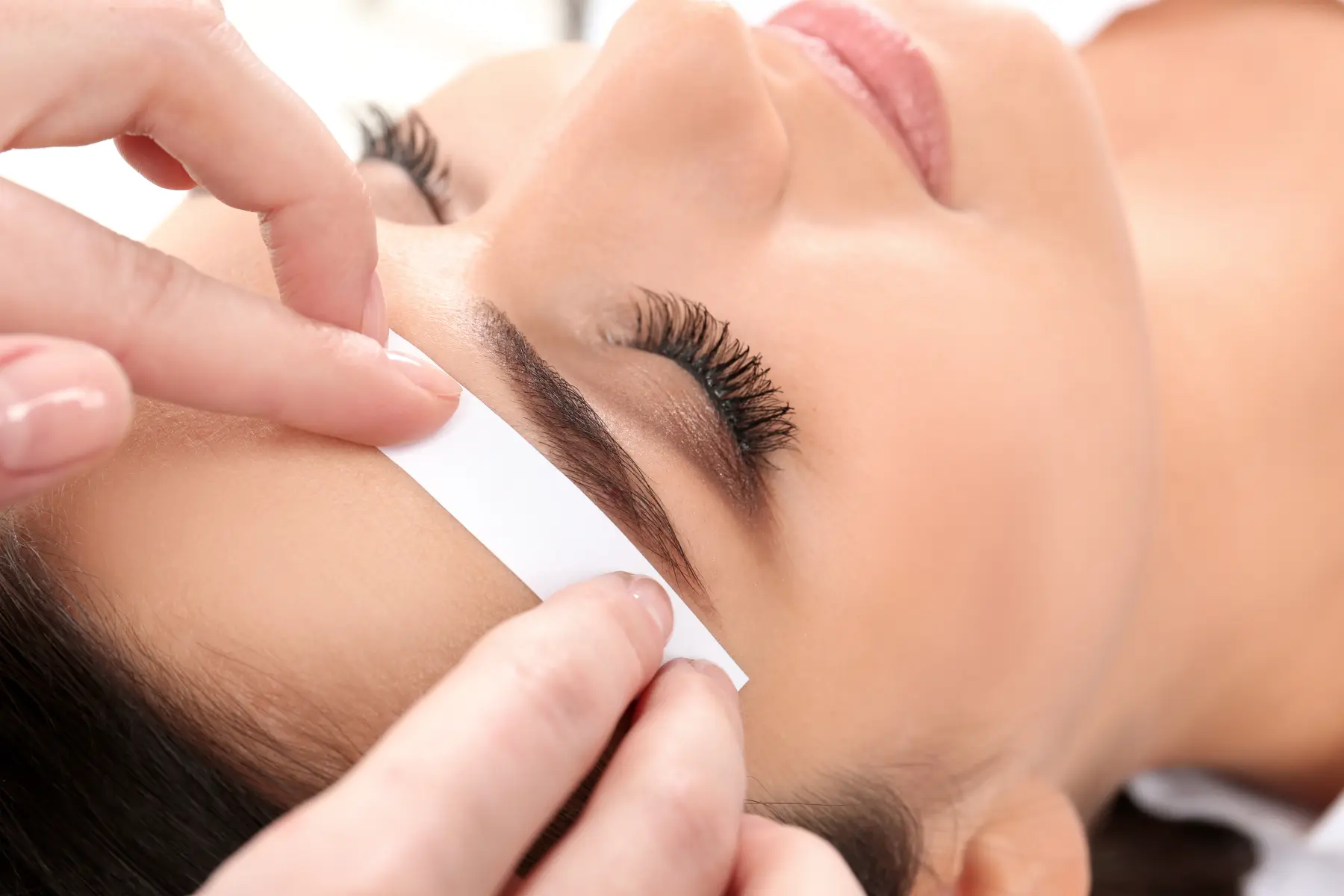 woman-getting-eyebrow-waxed-in-a-beauty-salon-2026-03-27-01-20-49-utc