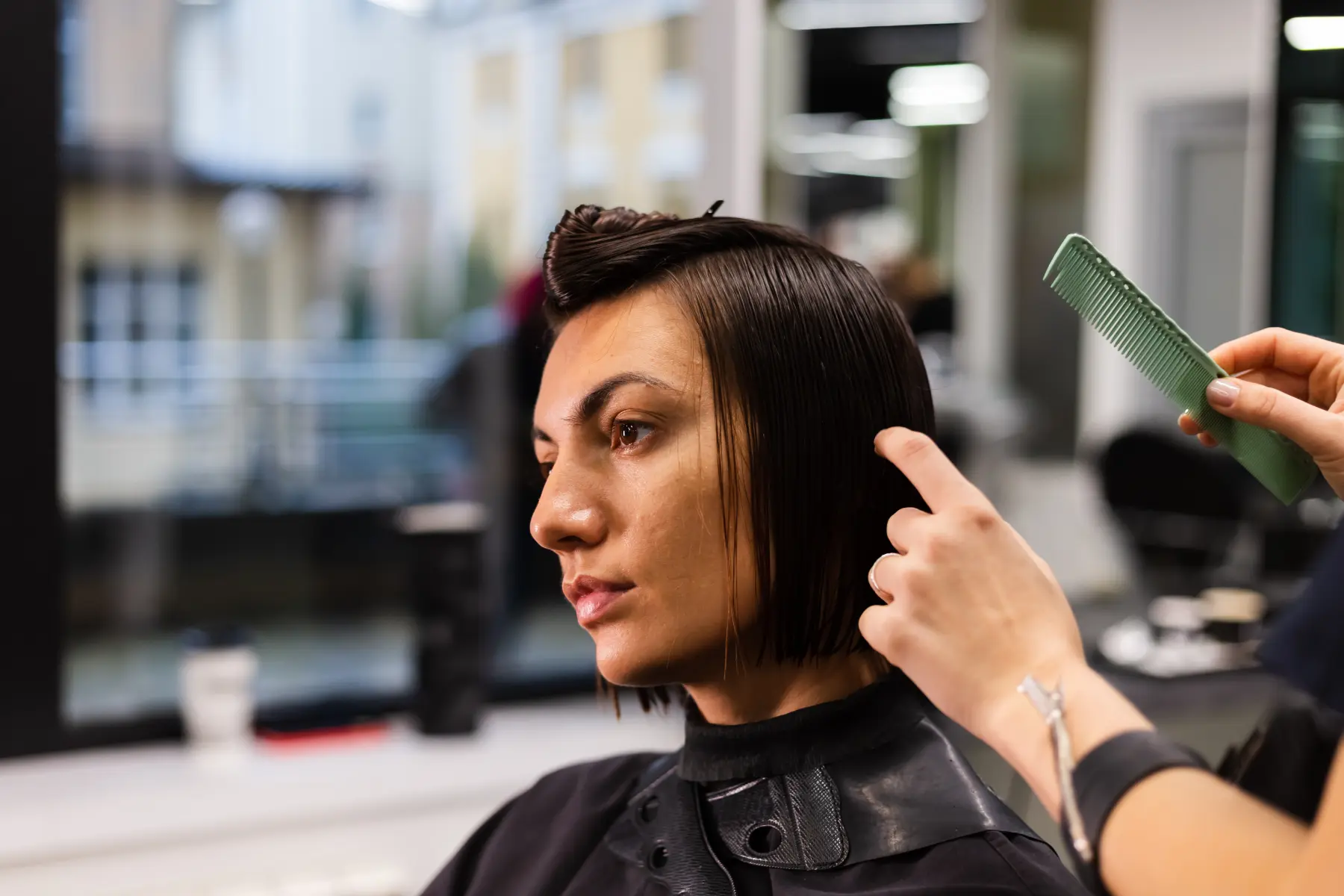 woman-getting-haircut-in-modern-salon-2026-03-09-23-57-06-utc