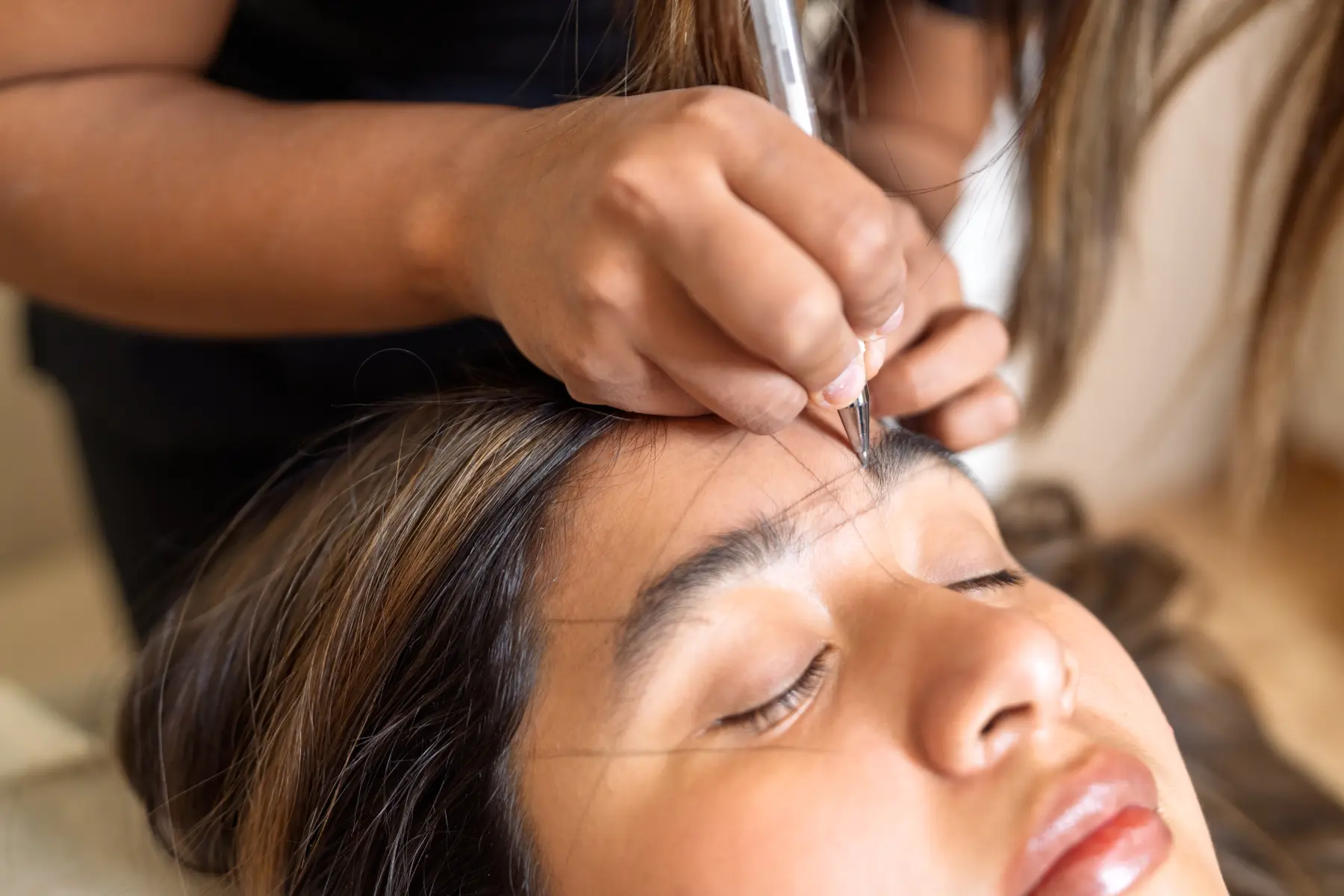 woman-having-her-eyebrows-shaped-for-microblading-2026-03-27-00-48-38-utc