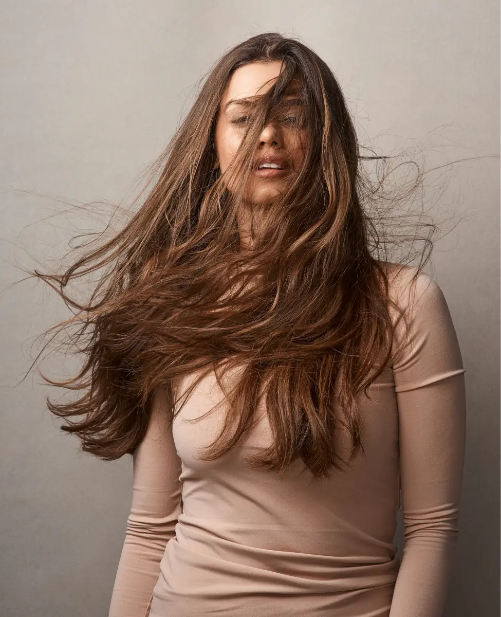 woman-posing-with-flowing-hair-in-studio-2026-03-25-03-07-09-utc