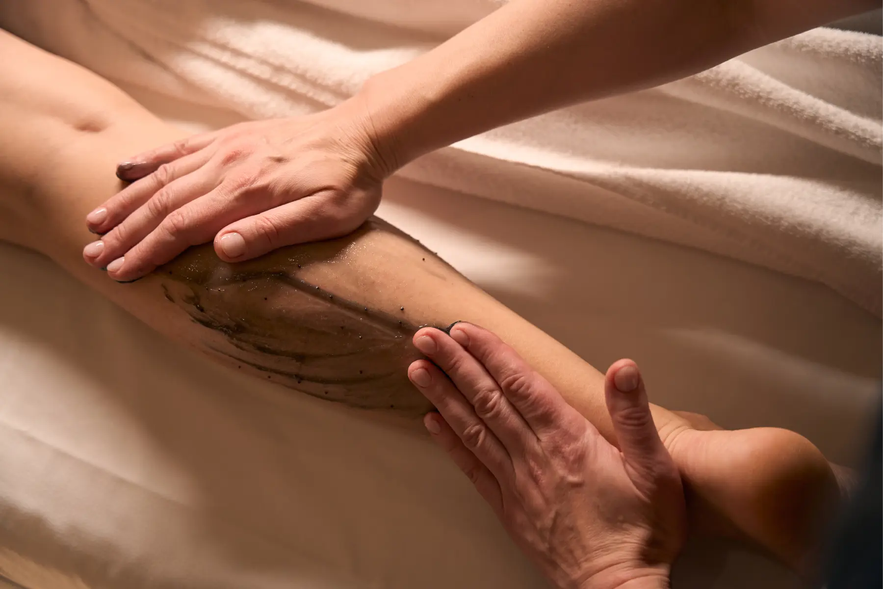 woman-receiving-leg-scrub-treatment-at-spa-2026-03-10-02-11-49-utc