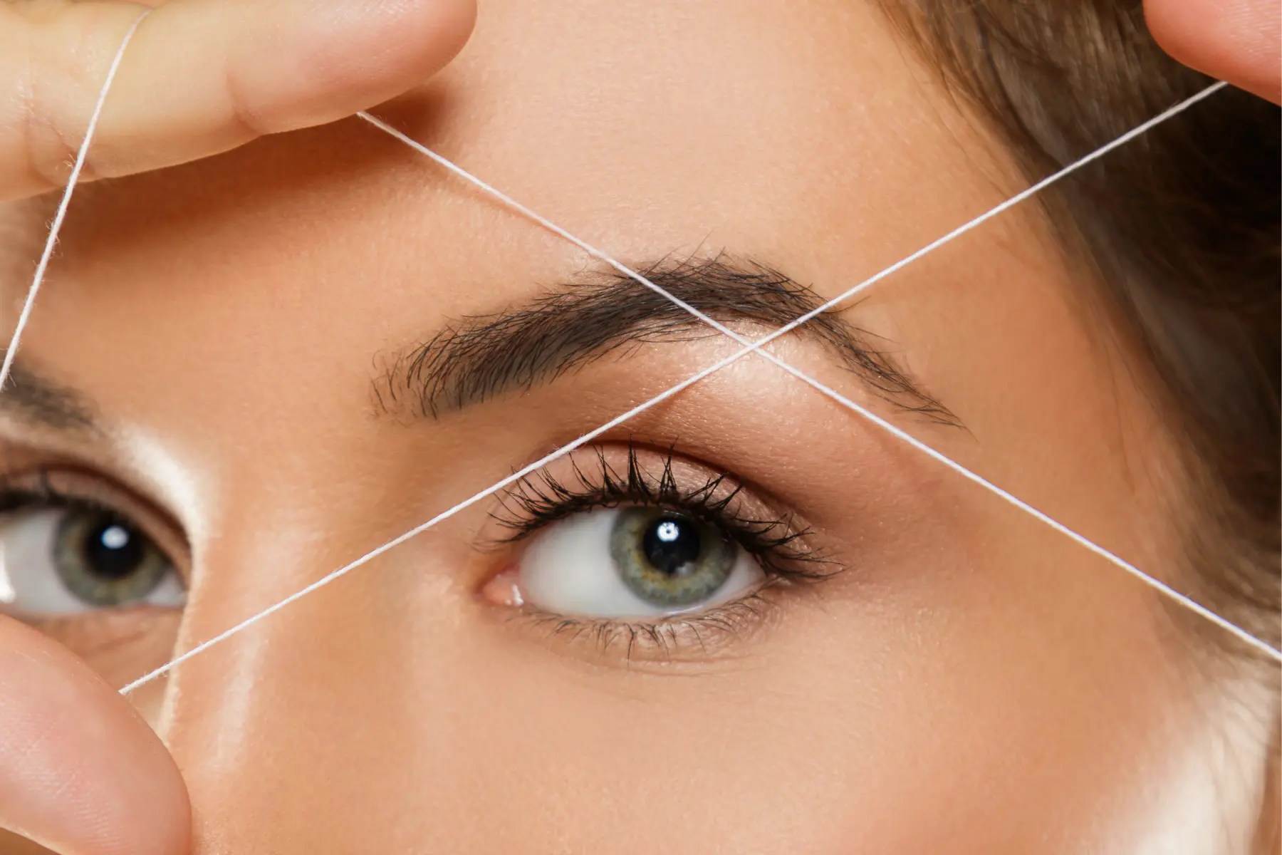 woman-s-eye-during-eyebrow-threading-process-macr-2026-03-10-01-03-55-utc