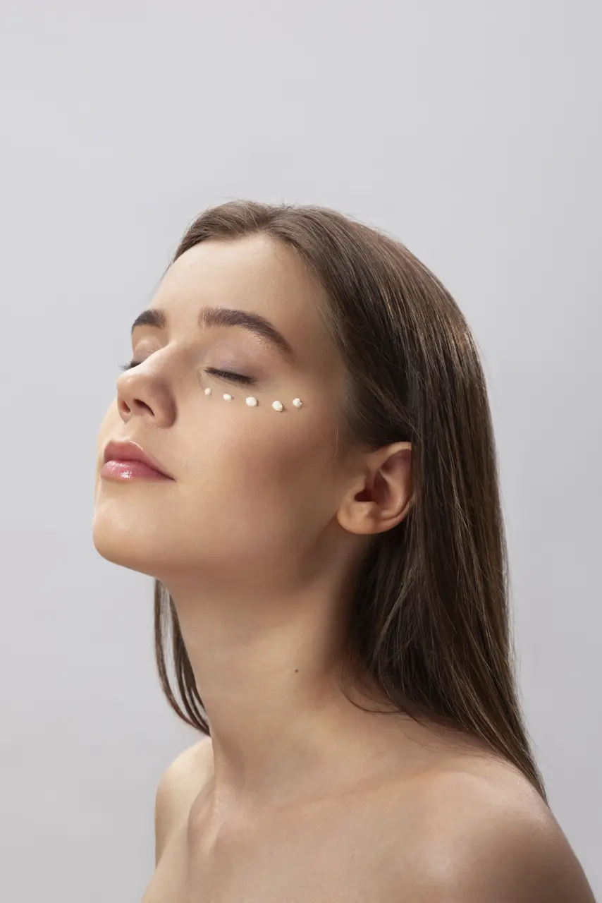 woman-using-eye-cream-side-view