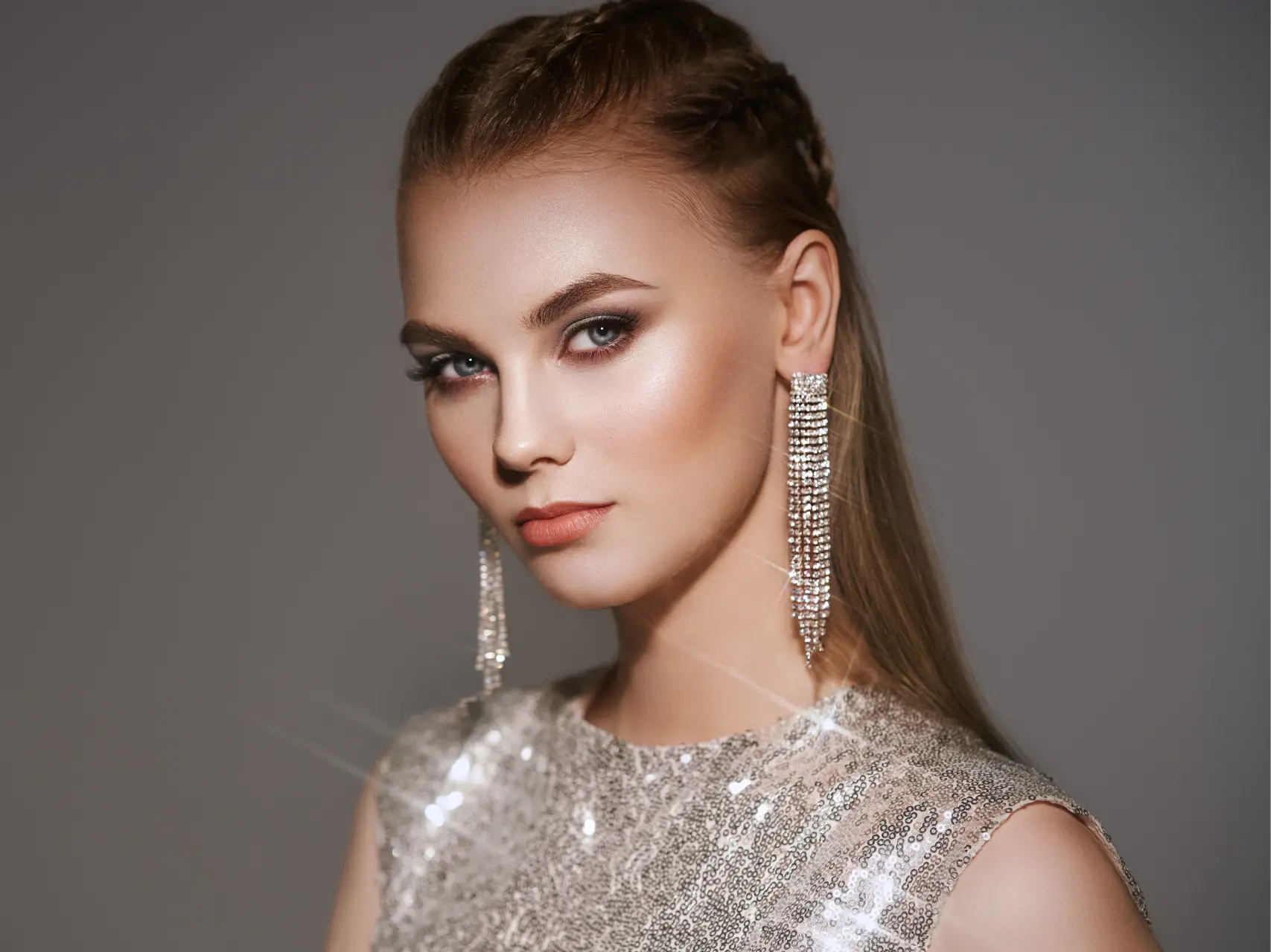 woman-with-braided-hair-and-sparkling-earrings-2026-03-24-09-48-00-utc