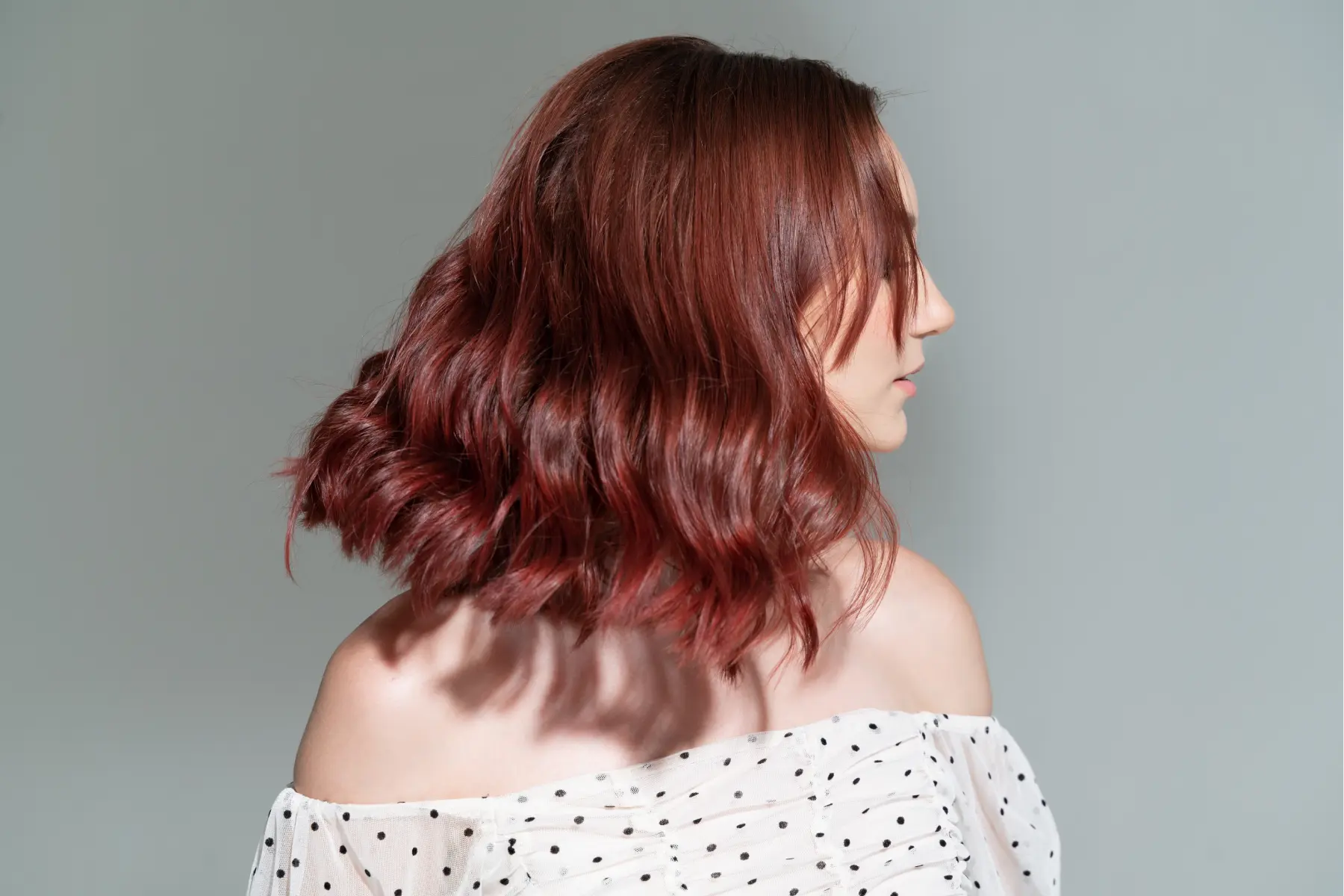 woman-with-wavy-auburn-hair-in-beauty-shoot-2026-03-20-03-58-49-utc