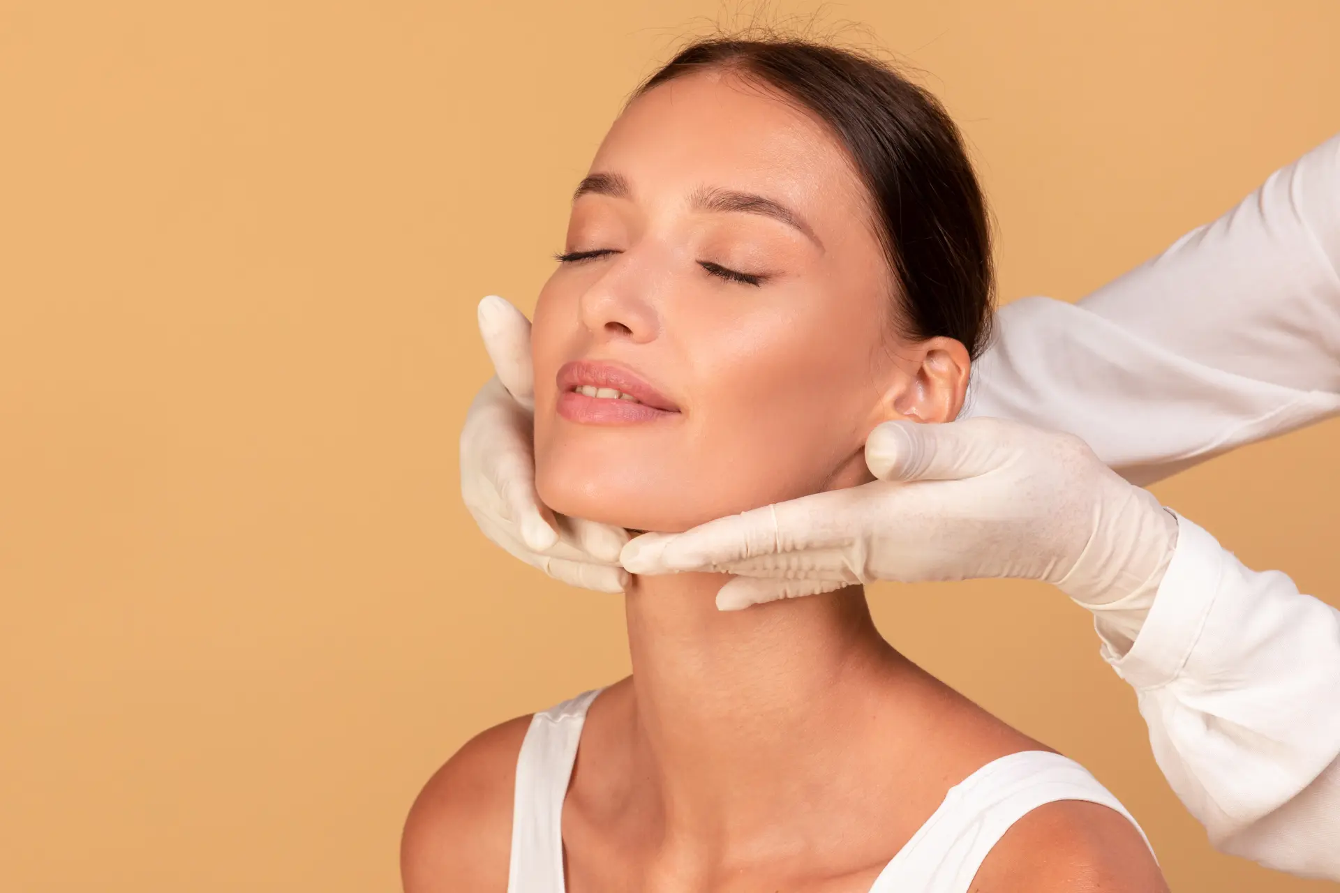 young-lady-with-smooth-skin-receiving-inspecting-face-medical-centre-cosmetologist-rubber-gloves-touching-neck