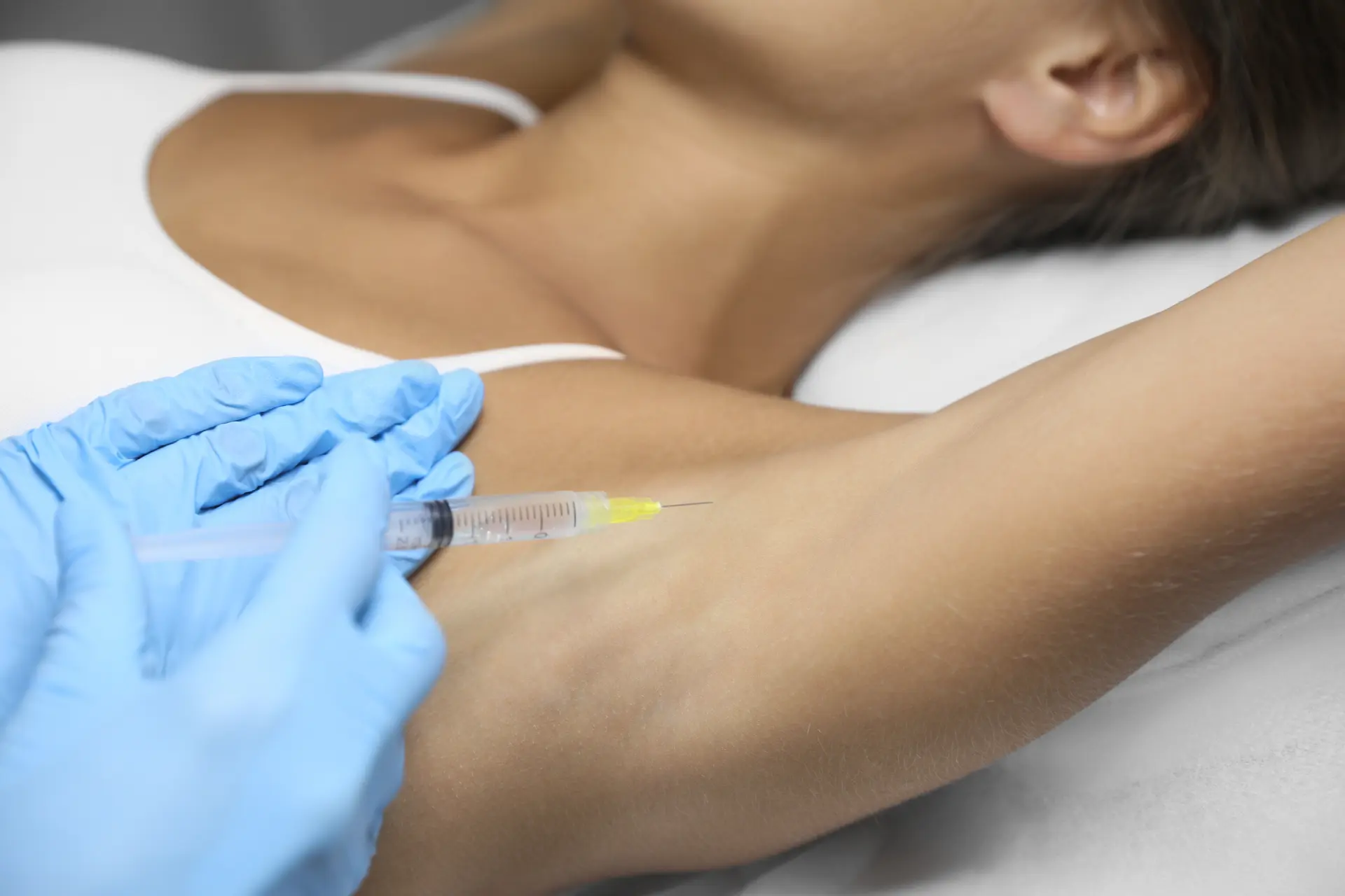 young-woman-getting-armpits-injection-salon-closeup